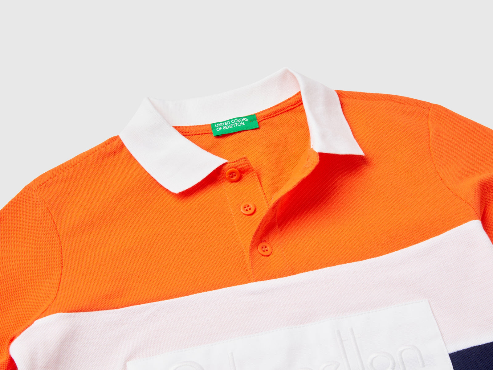 Polo color block in cotone bio da bambino arancione 3 | Benetton Outlet