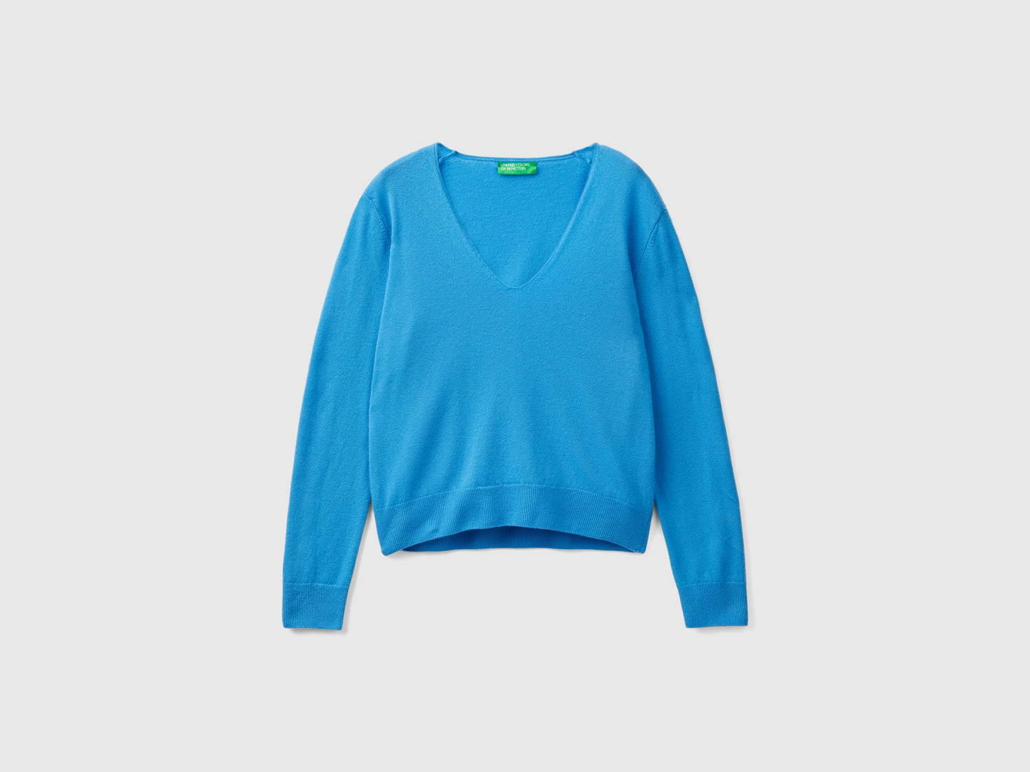 Maglione con scollo a V in pura lana Merino da donna azzurro | Benetton Outlet