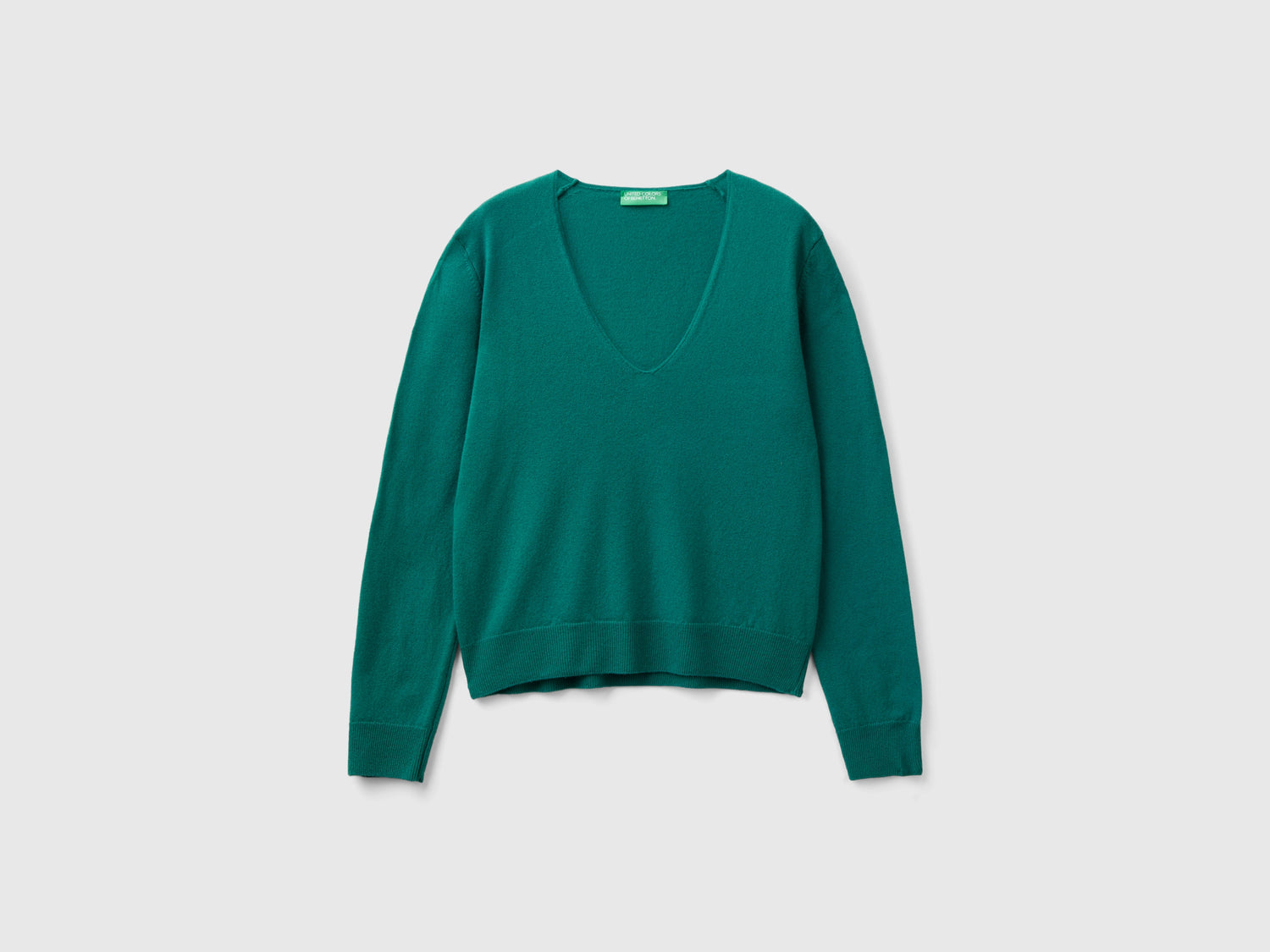Maglione verde bosco con scollo a V in pura lana Merino da donna verde scuro | Benetton Outlet
