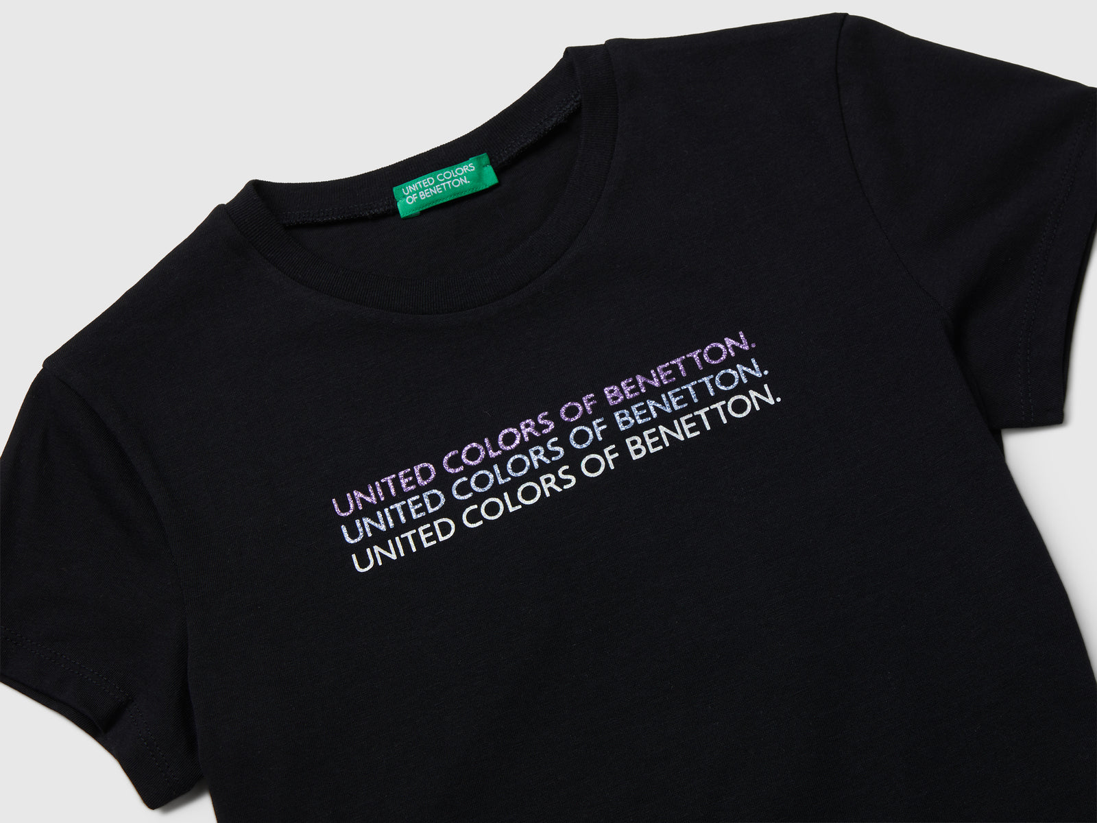 T-shirt con logo glitter da bambina nero 3 | Benetton Outlet