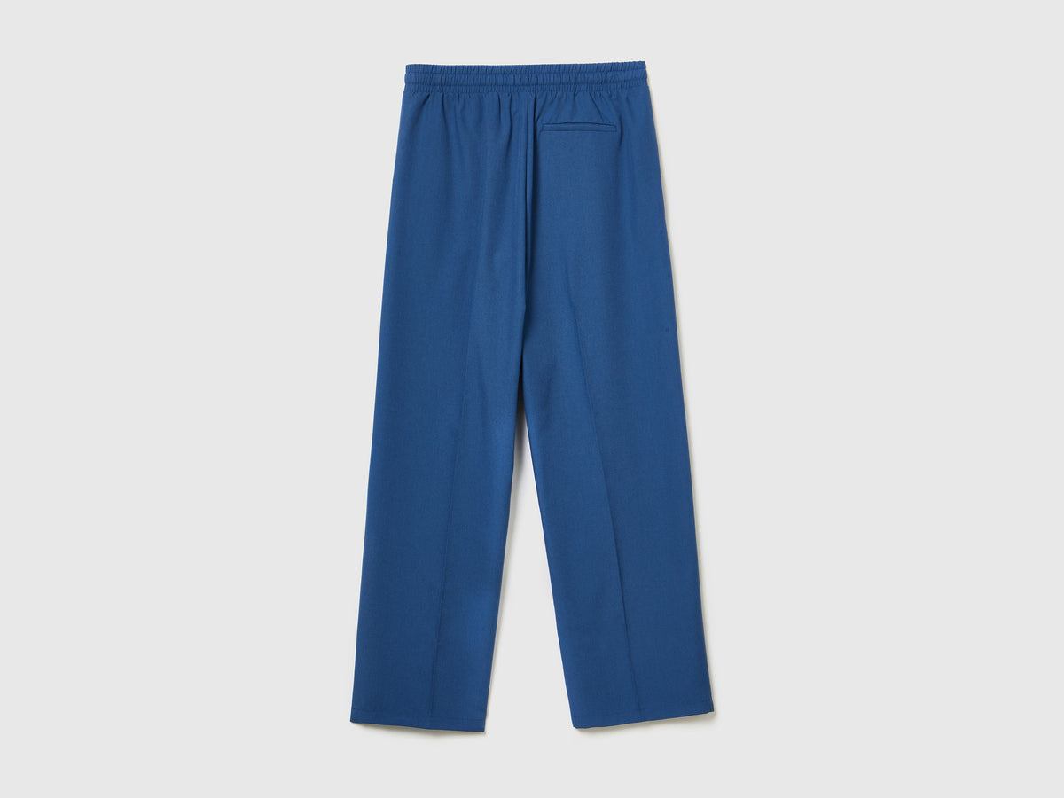 Pantaloni lunghi fluidi modello jogger in misto viscosa