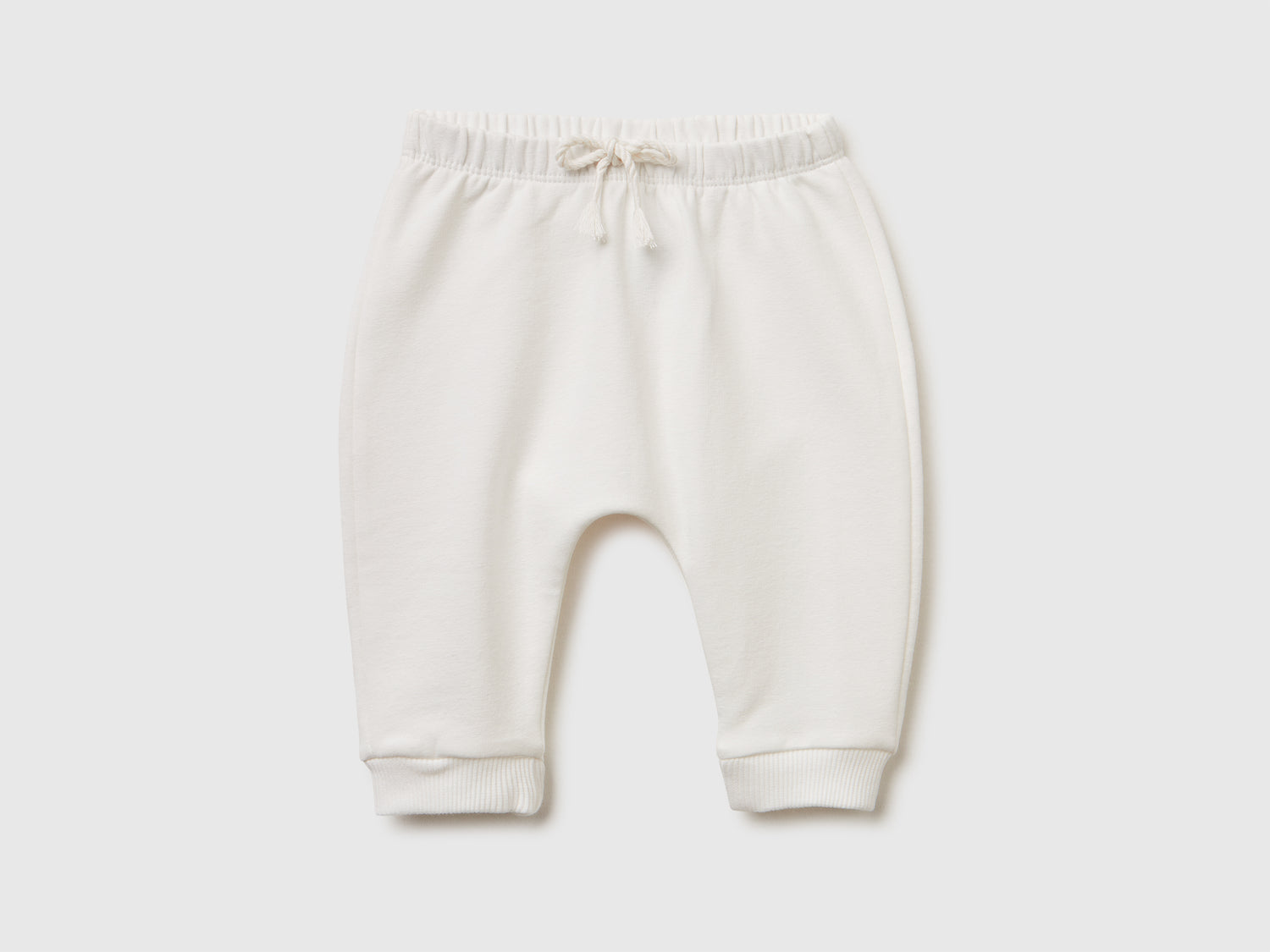 Pantaloni in calda felpa con taschino da neonato bianco panna | Benetton Outlet