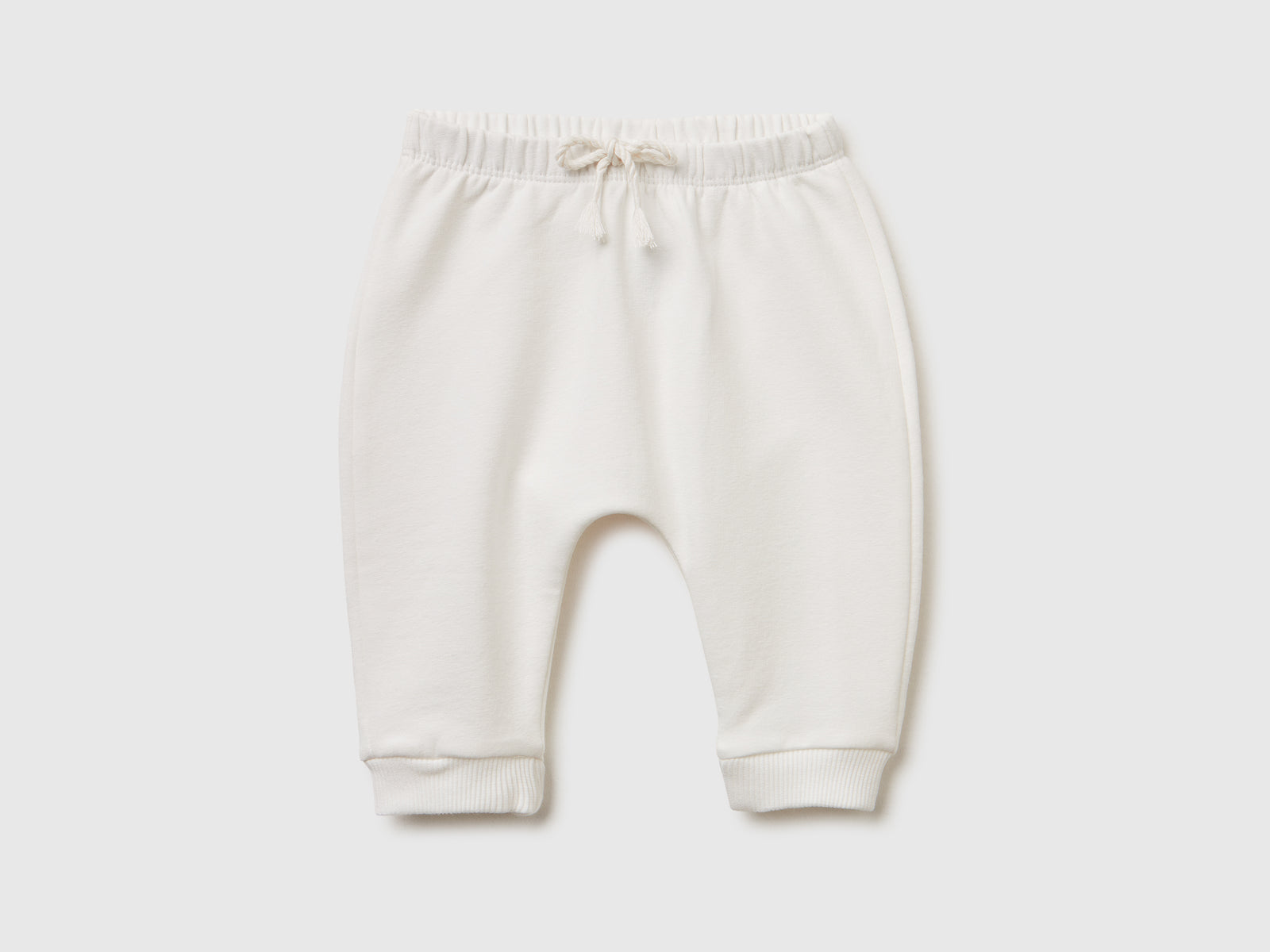 Pantaloni in calda felpa con taschino da neonato bianco panna | Benetton Outlet