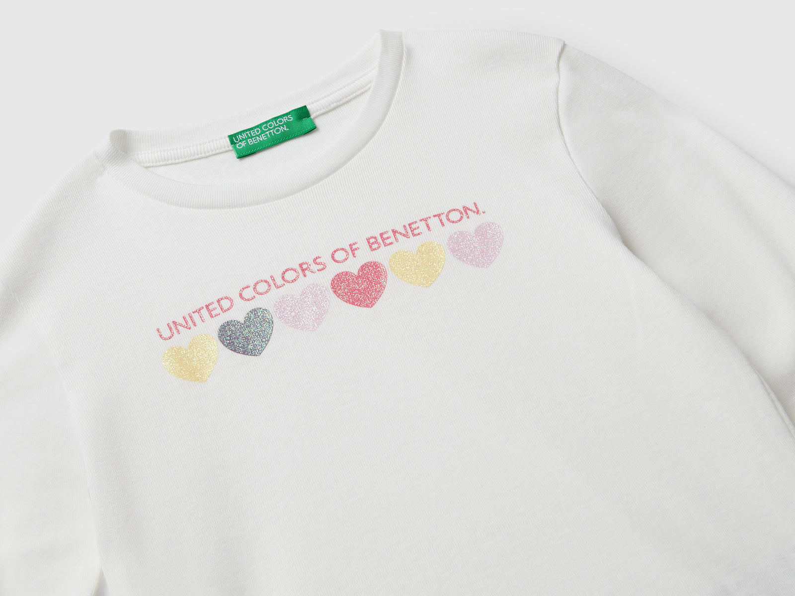 T-shirt con logo glitter in cotone da bimba bianco panna 3 | Benetton Outlet