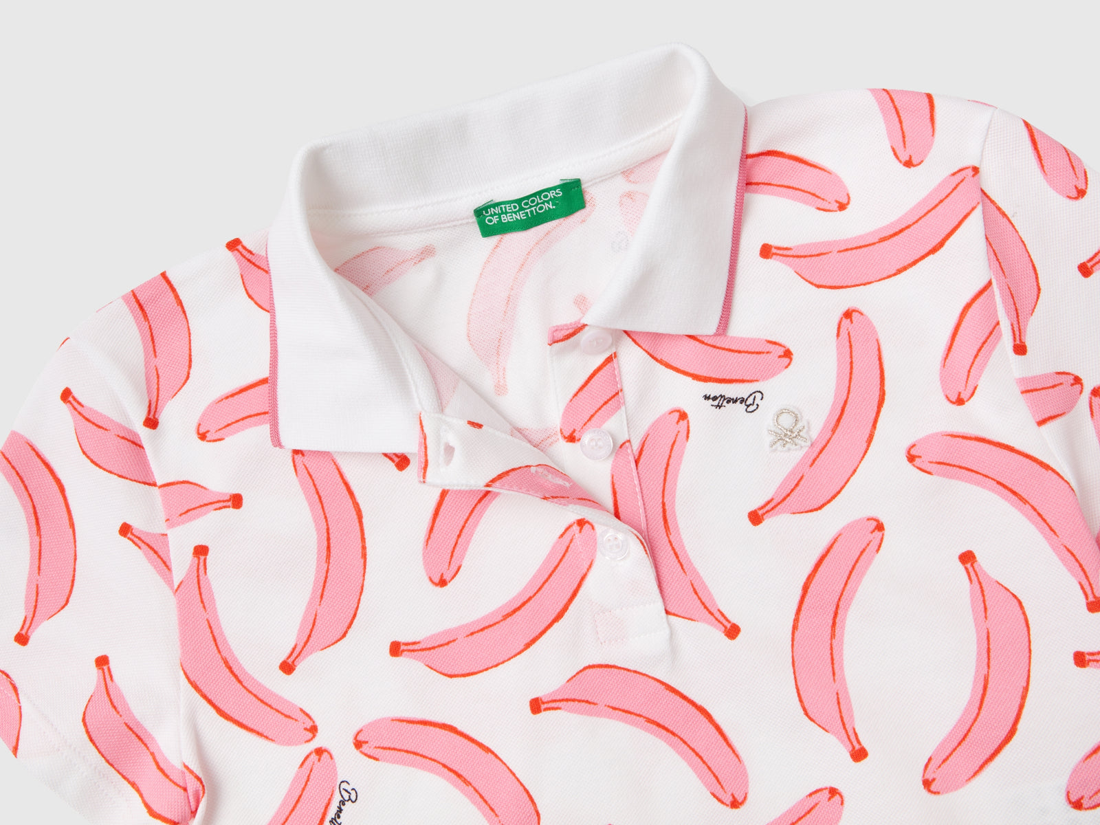 Polo con pattern banane da bambina bianco 2 | Benetton Outlet