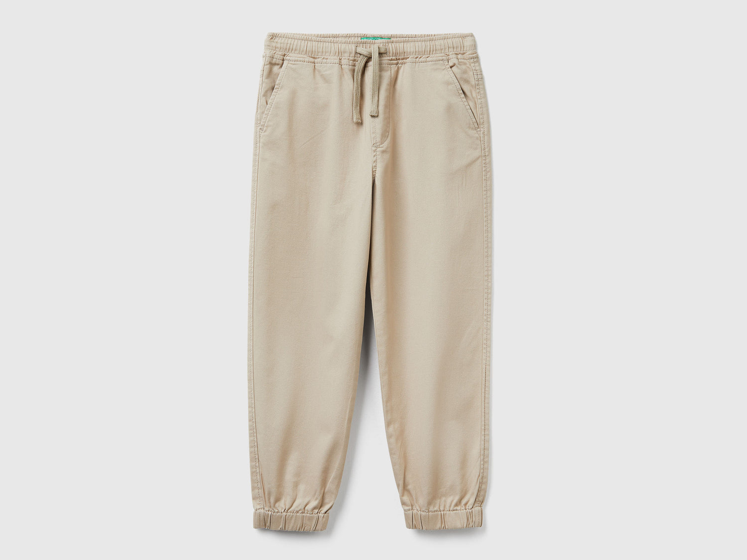 Joggers in cotone stretch con coulisse da bambino beige | Benetton Outlet