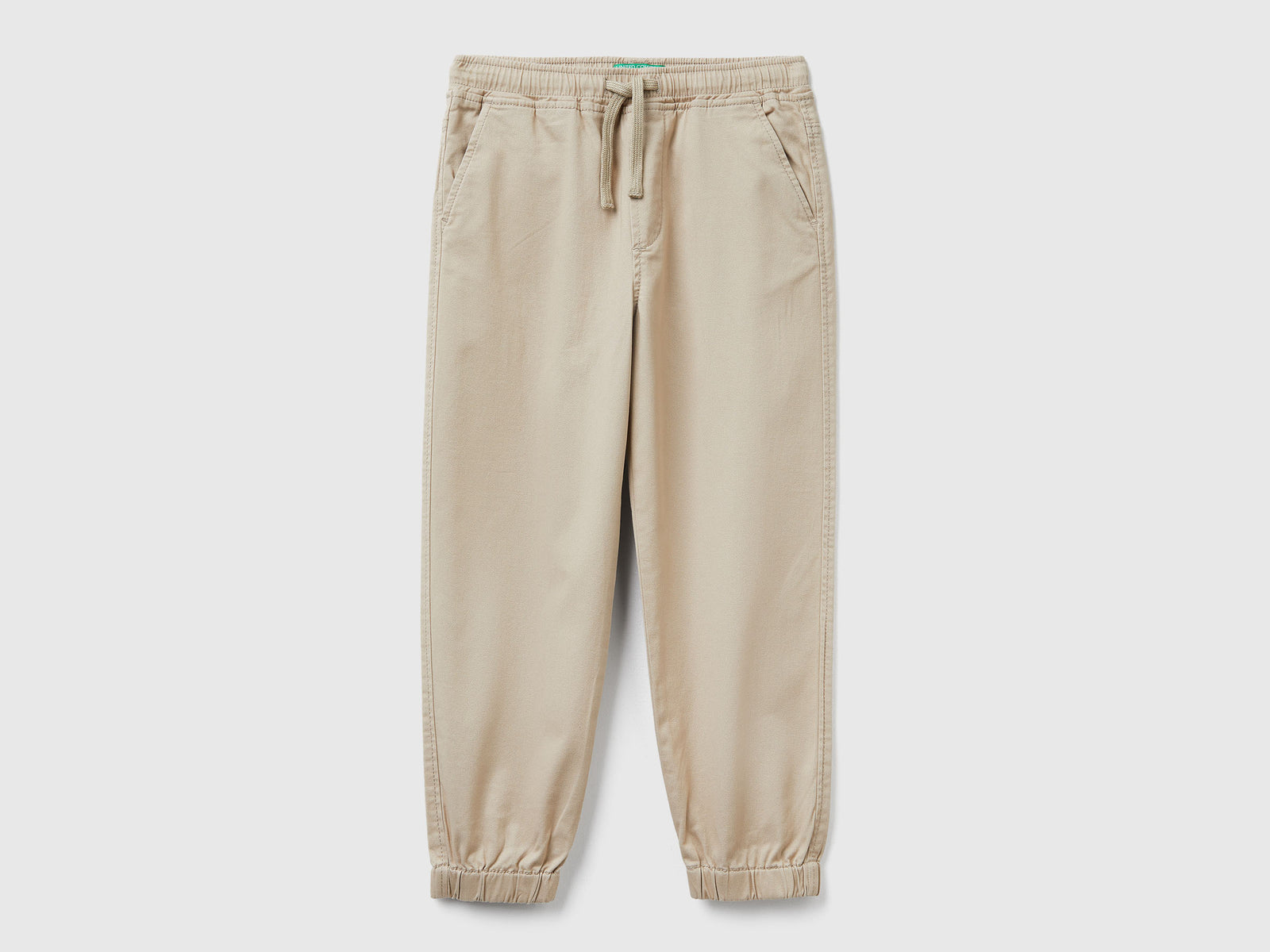 Joggers in cotone stretch con coulisse da bambino beige | Benetton Outlet