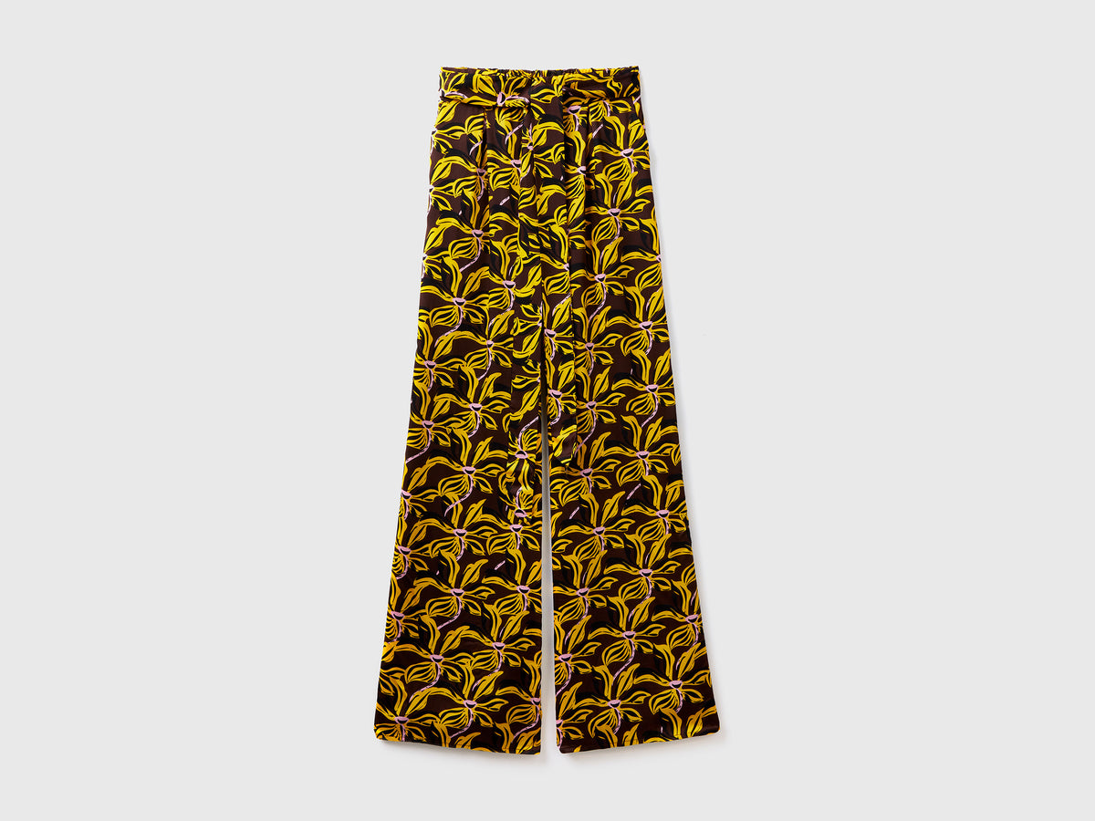 Pantaloni lunghi in pura viscosa con fantasia floreale su tutto il capo da donna multi-color | Benetton Outlet