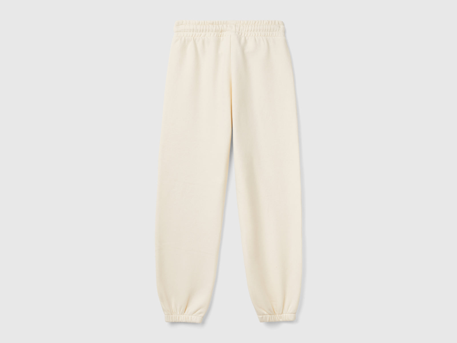 Joggers in felpa con coulisse da bambina bianco panna 2 | Benetton Outlet