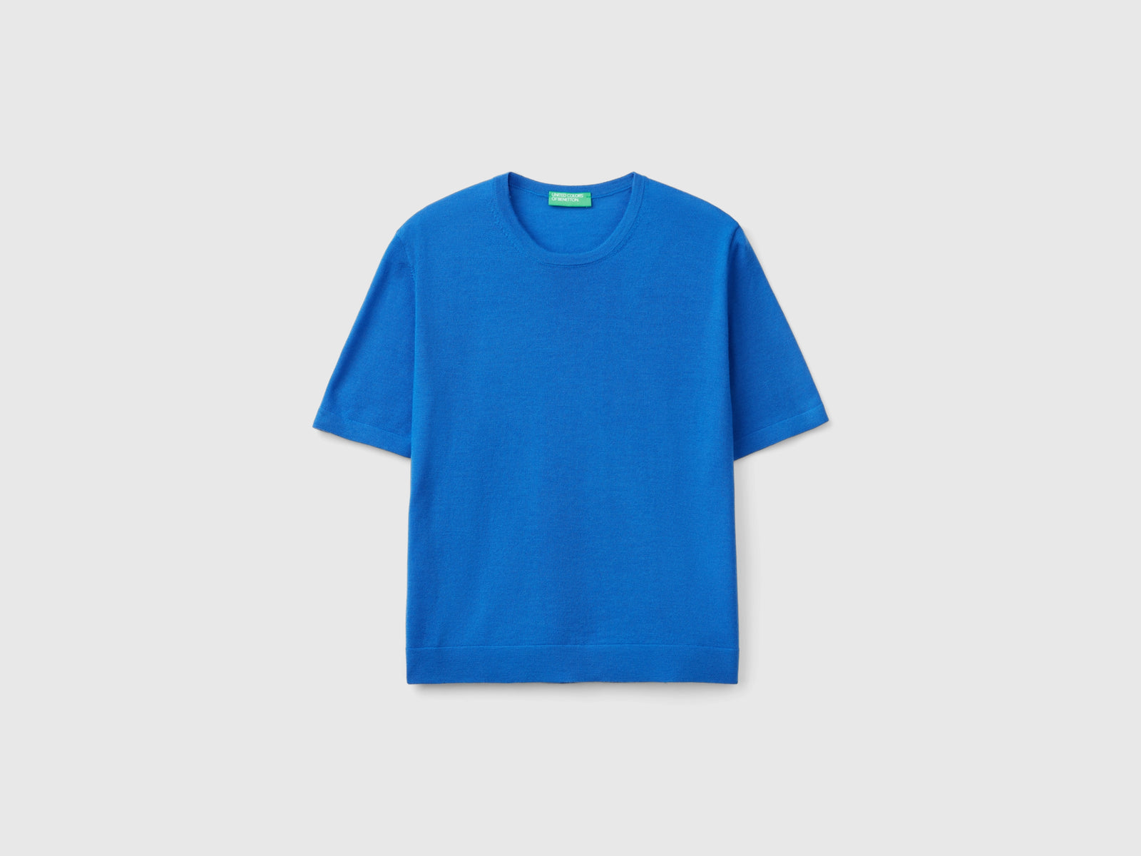 Maglia manica corta in pura lana Merino da donna azzurro | Benetton Outlet