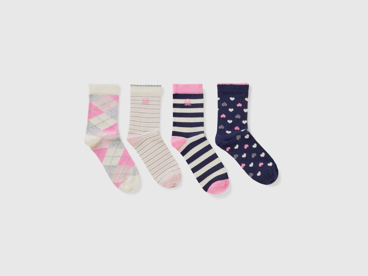 Quattro paia di calzini con fantasie jacquard da bambino multi-color | Benetton Outlet