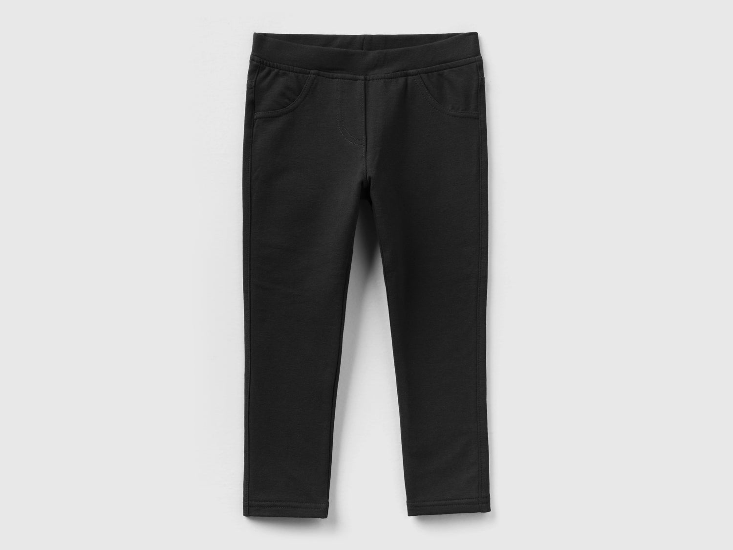 Jeggings in cotone bio stretch da bimba nero | Benetton Outlet