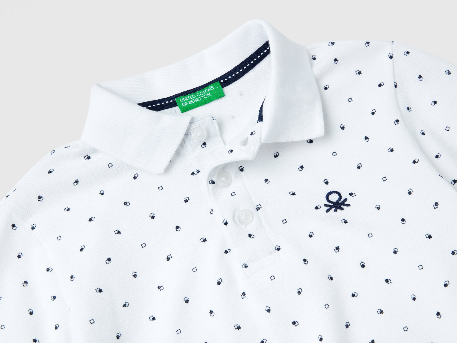Polo micro fantasia slim fit da bambino bianco 2 | Benetton Outlet