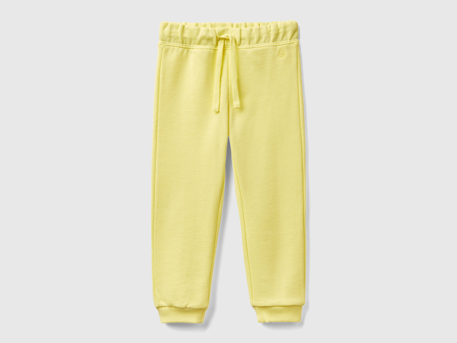 Pantaloni in felpa di cotone bio da bimba giallo | Benetton Outlet