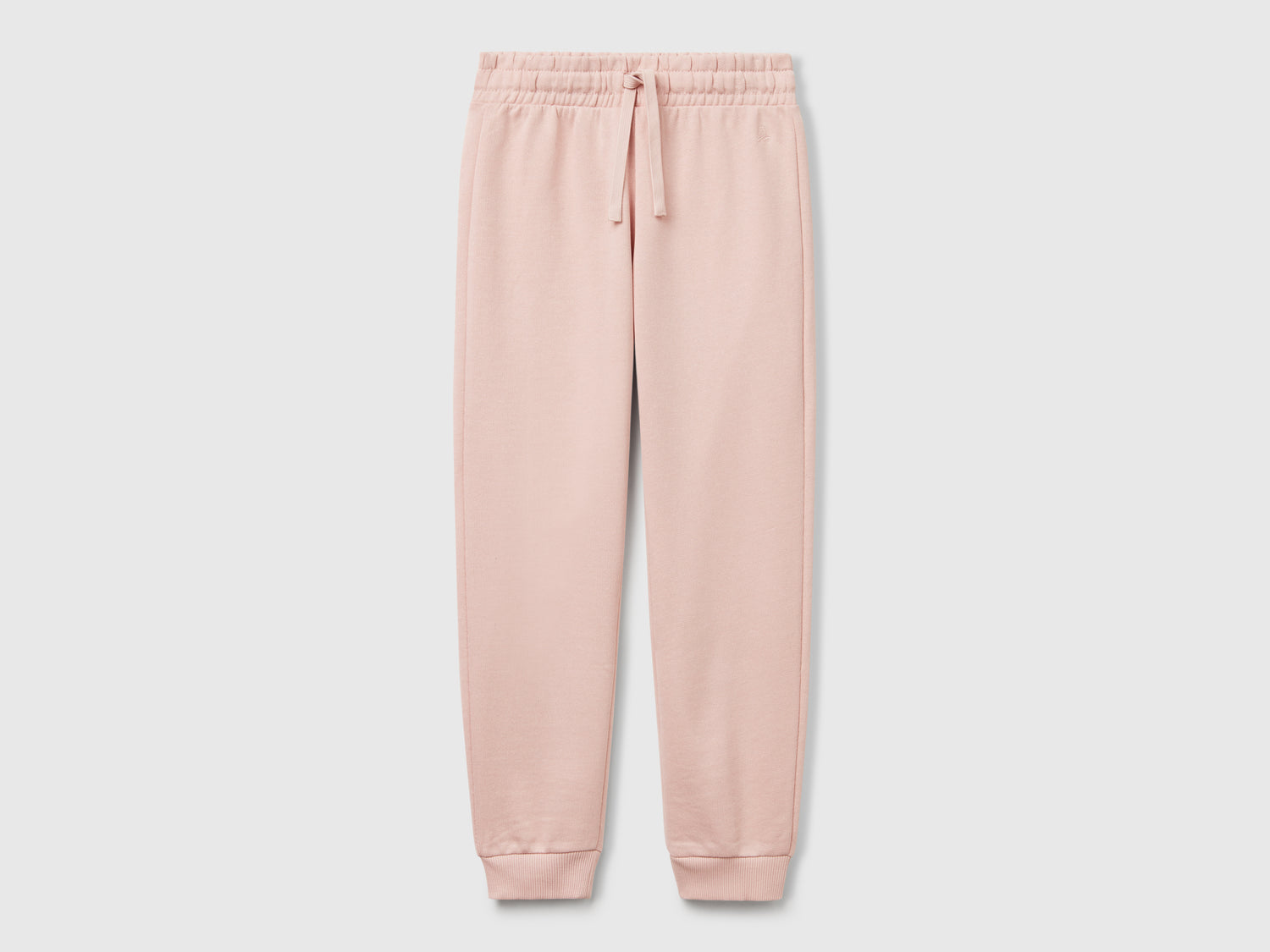Pantaloni in felpa con logo da bambina rosa carne | Benetton Outlet
