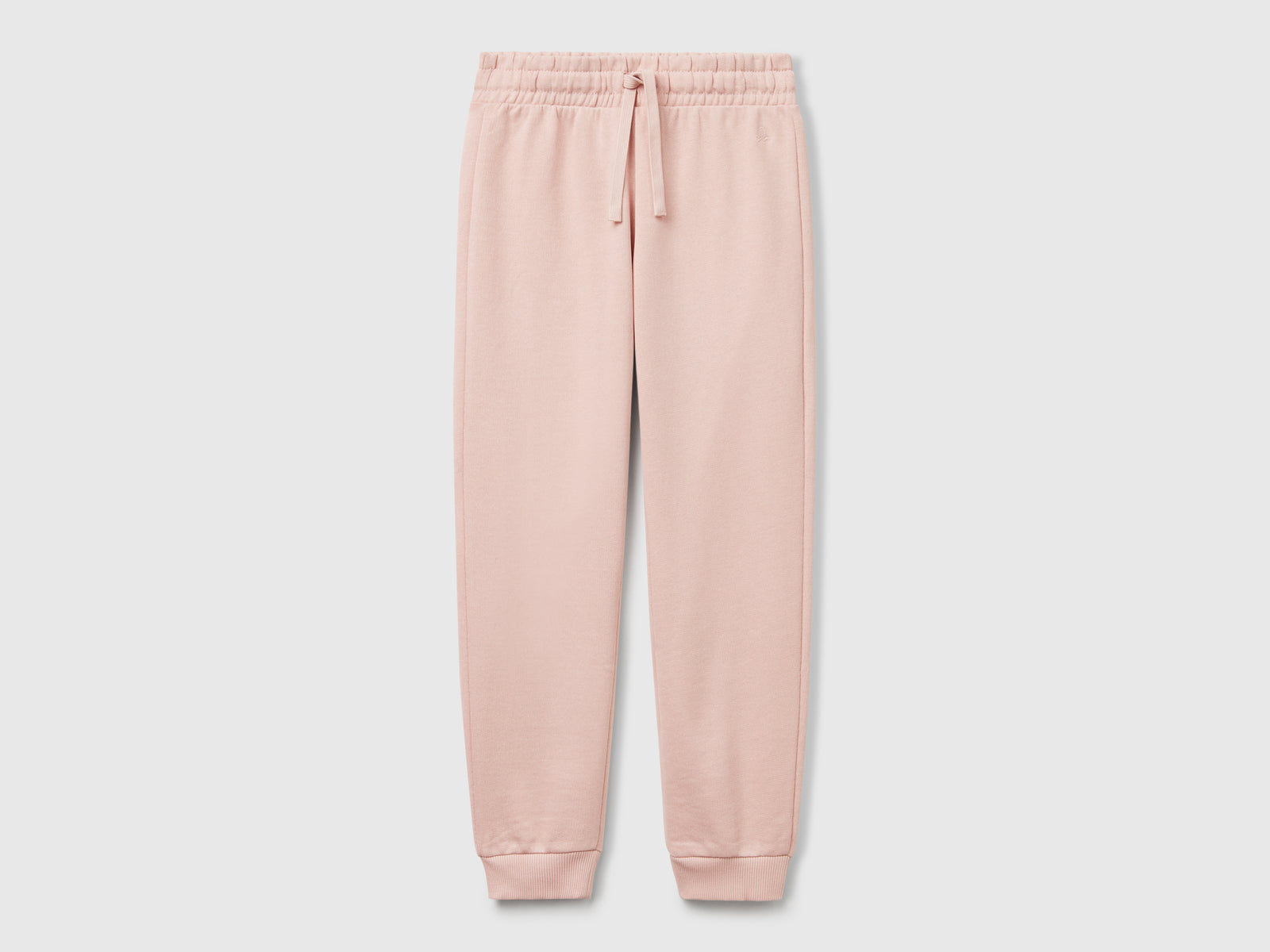 Pantaloni in felpa con logo da bambina rosa carne | Benetton Outlet