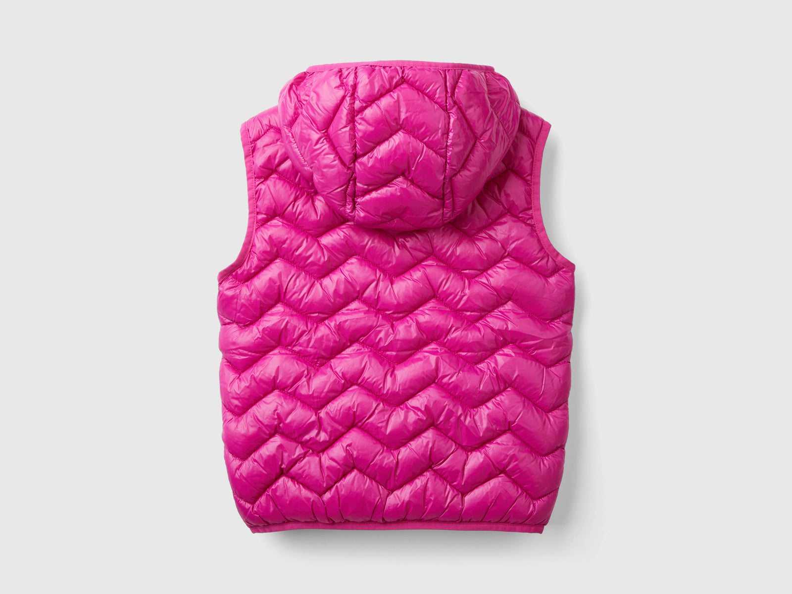 Gilet imbottito in ovatta 3D con cappuccio da bambina fucsia 2 | Benetton Outlet