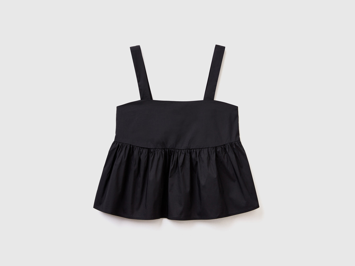 Top a canotta in misto cotone elasticizzato con balza arricciata da donna nero | Benetton Outlet