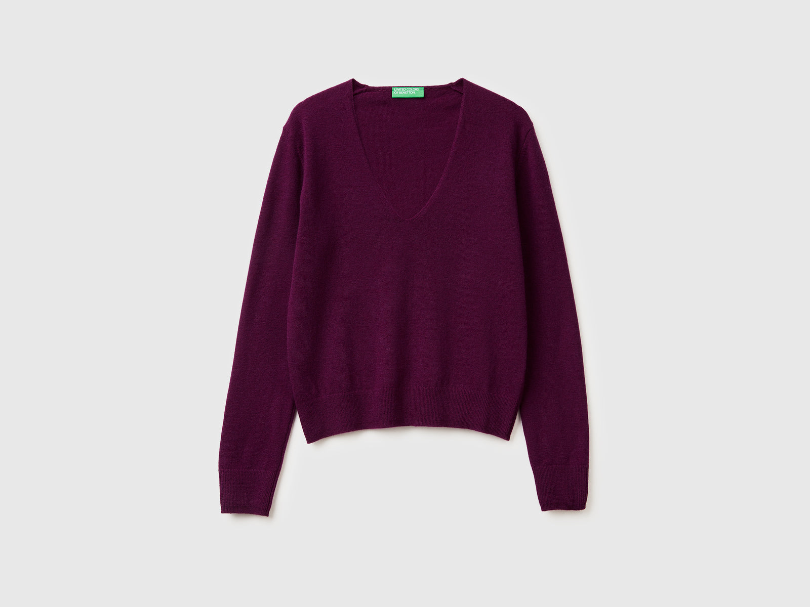 Maglione viola con scollo a V in pura lana Merino da donna prugna | Benetton Outlet