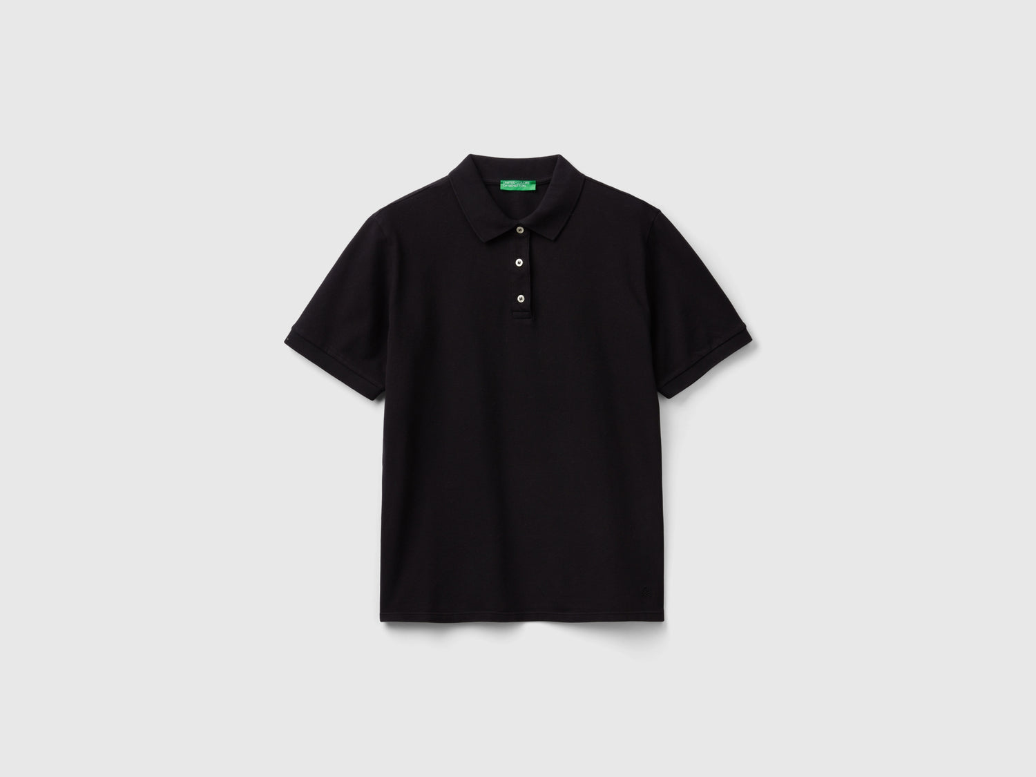 Polo in cotone bio stretch da donna nero | Benetton Outlet