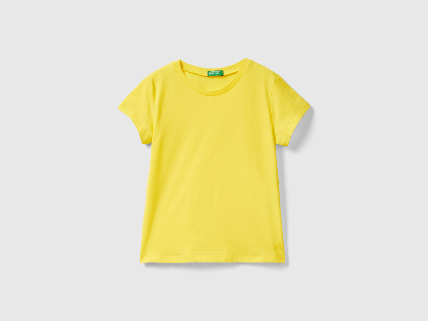 T-shirt in puro cotone bio da bambina giallo | Benetton Outlet