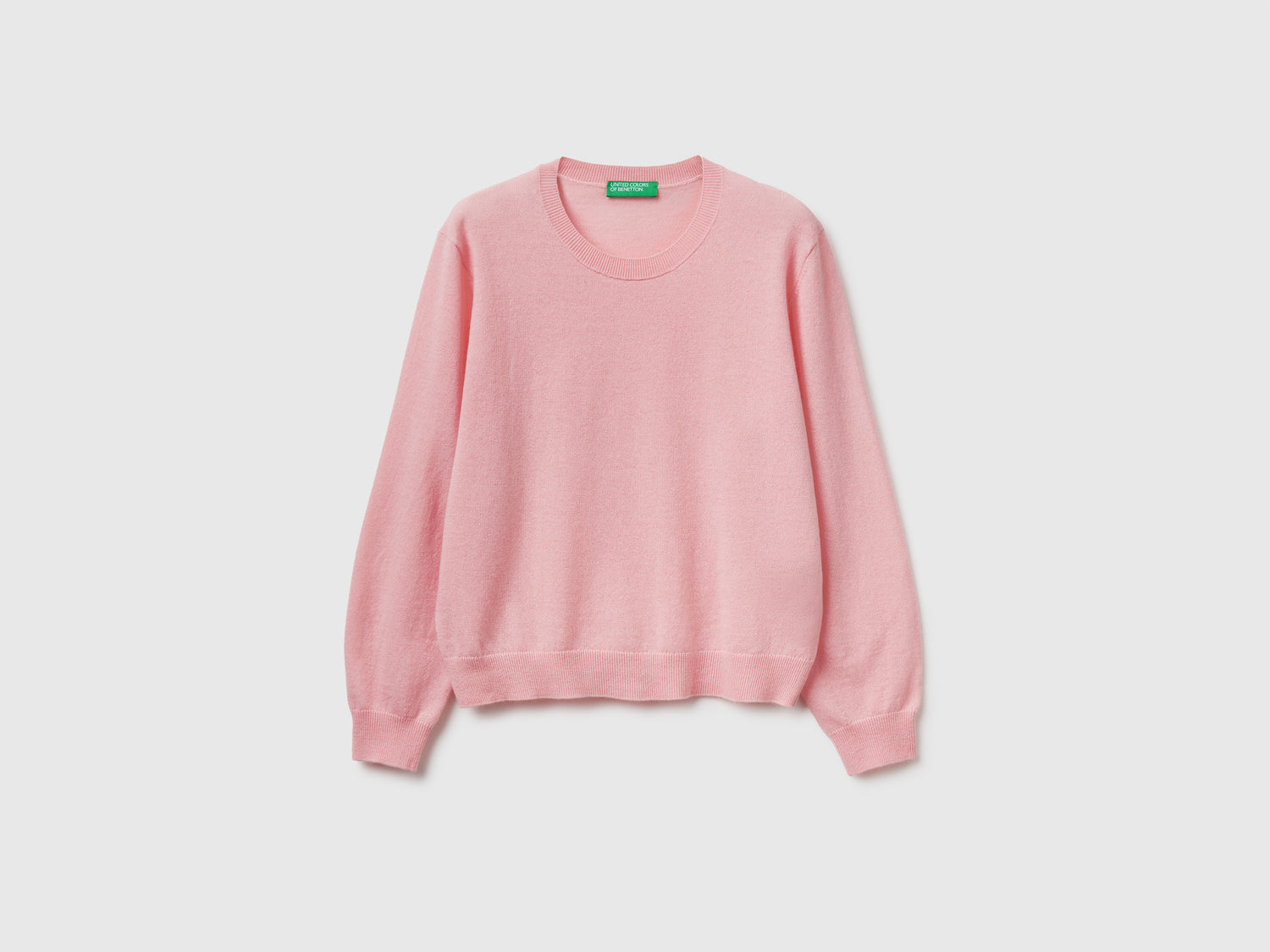 Maglia relaxed fit in pura lana Merino da donna rosa tenue | Benetton Outlet