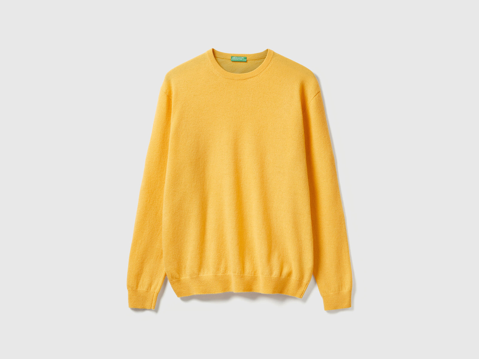 Maglia girocollo giallo in pura lana Merino da uomo senape | Benetton Outlet