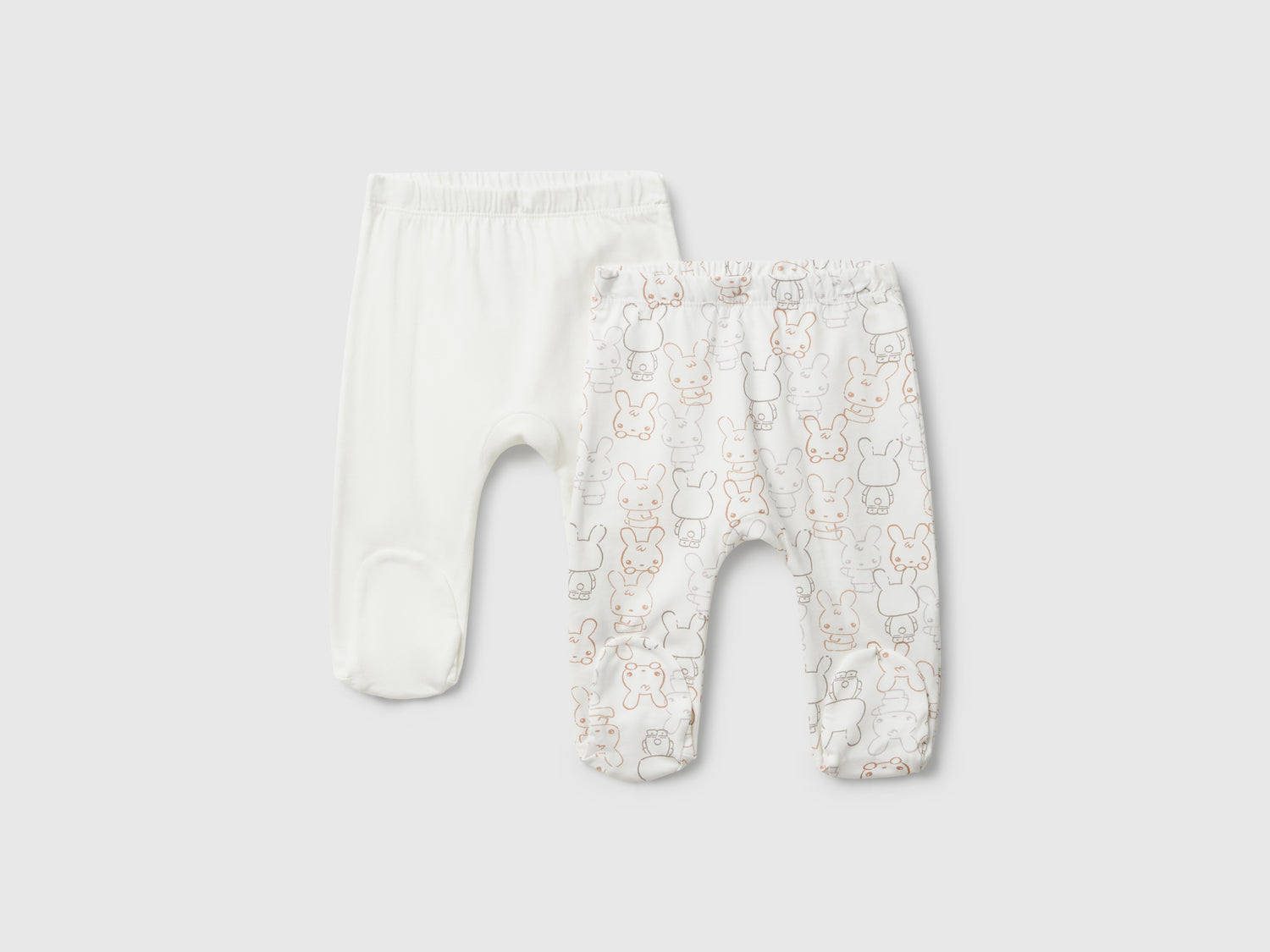 Due pantaloni in cotone da neonato bianco panna | Benetton Outlet