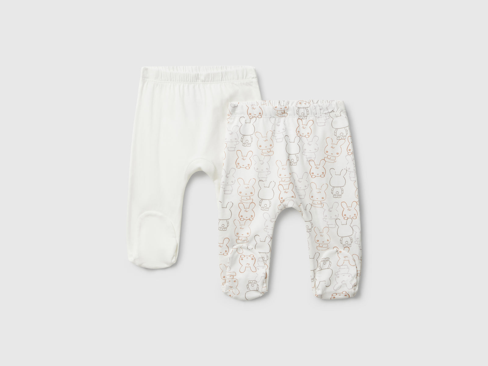 Due pantaloni in cotone da neonato bianco panna | Benetton Outlet