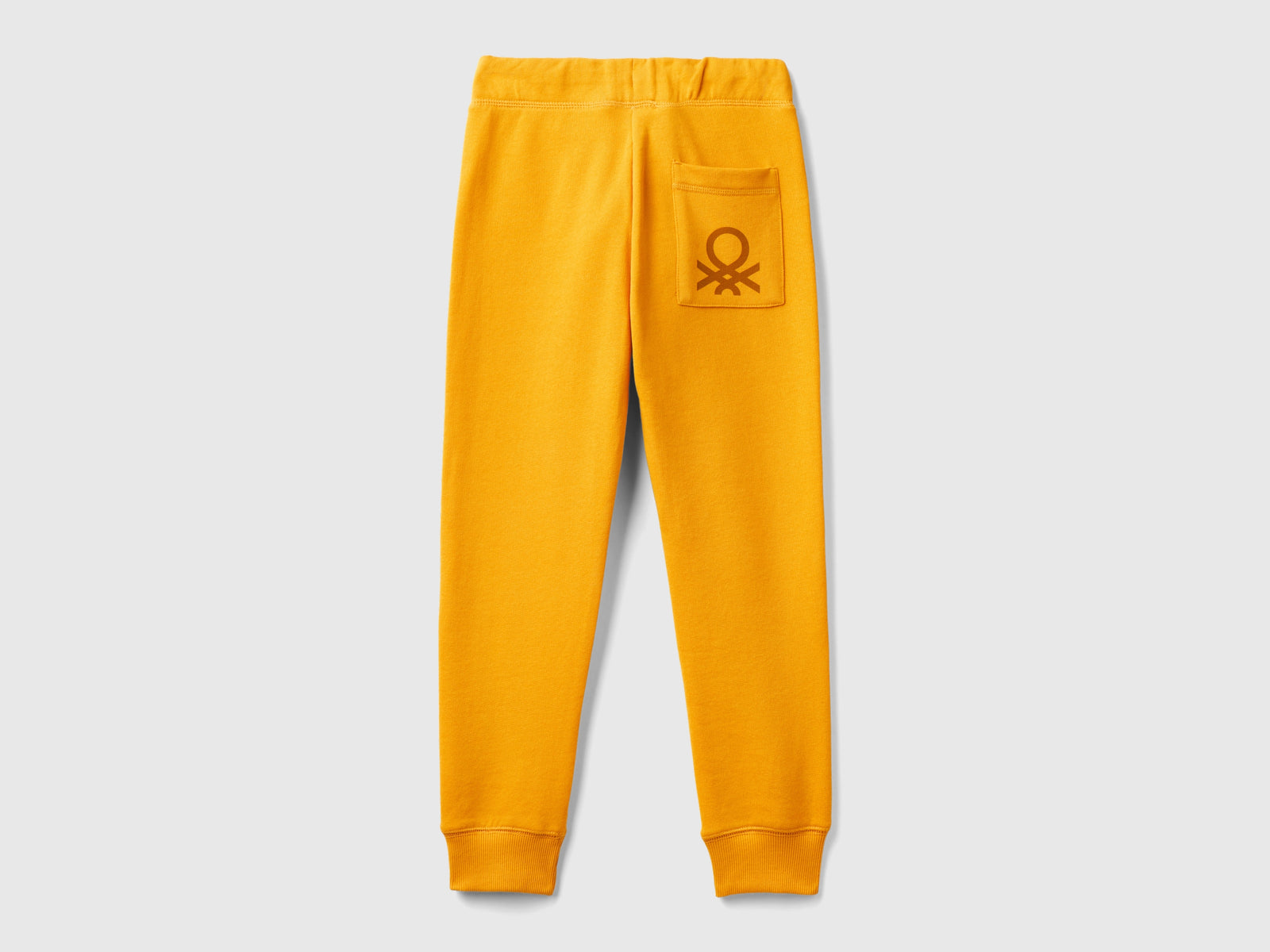Pantaloni in felpa 100% cotone da bambino senape 2 | Benetton Outlet