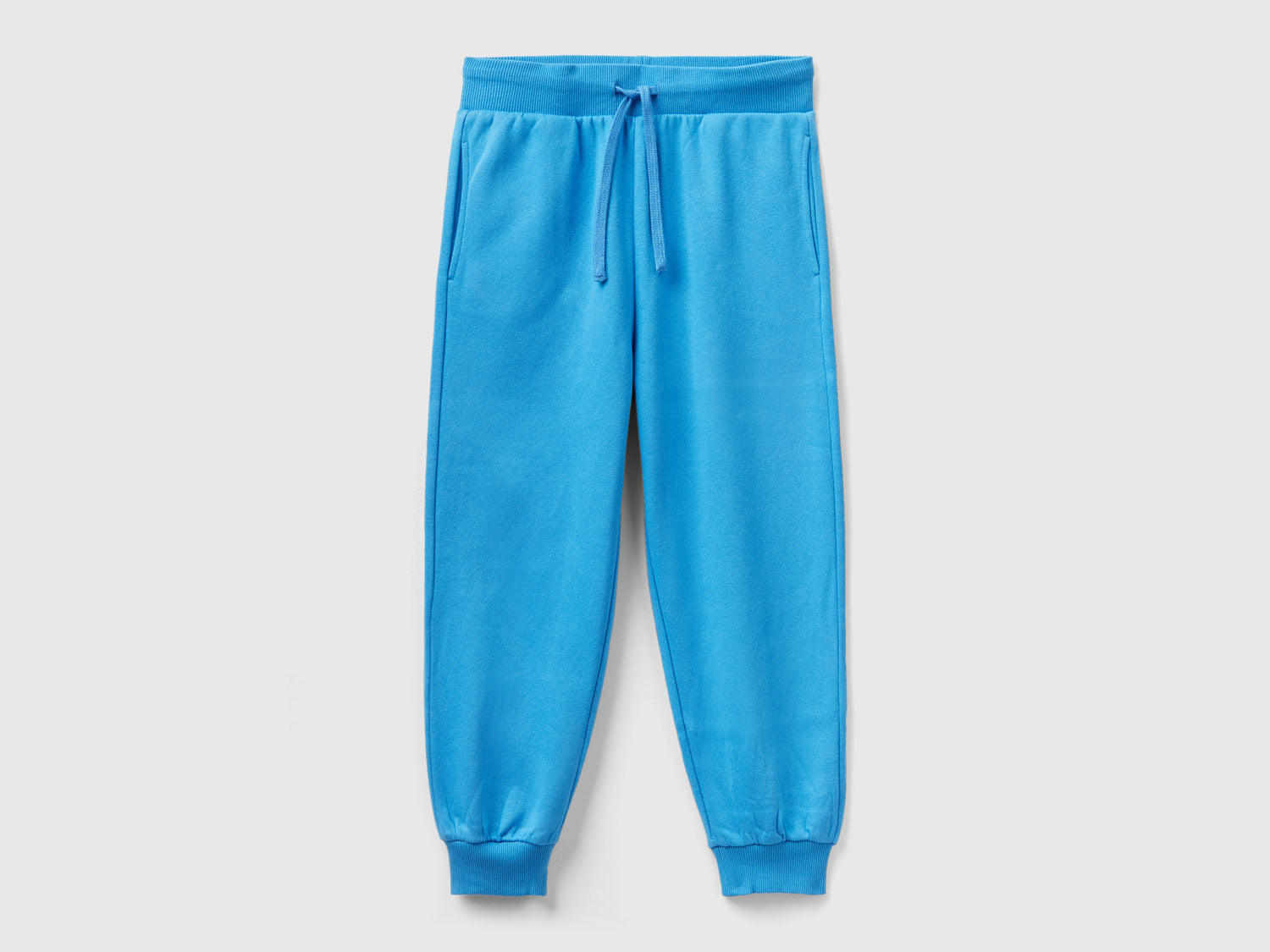 Joggers in tessuto riciclato da bambino azzurro | Benetton Outlet