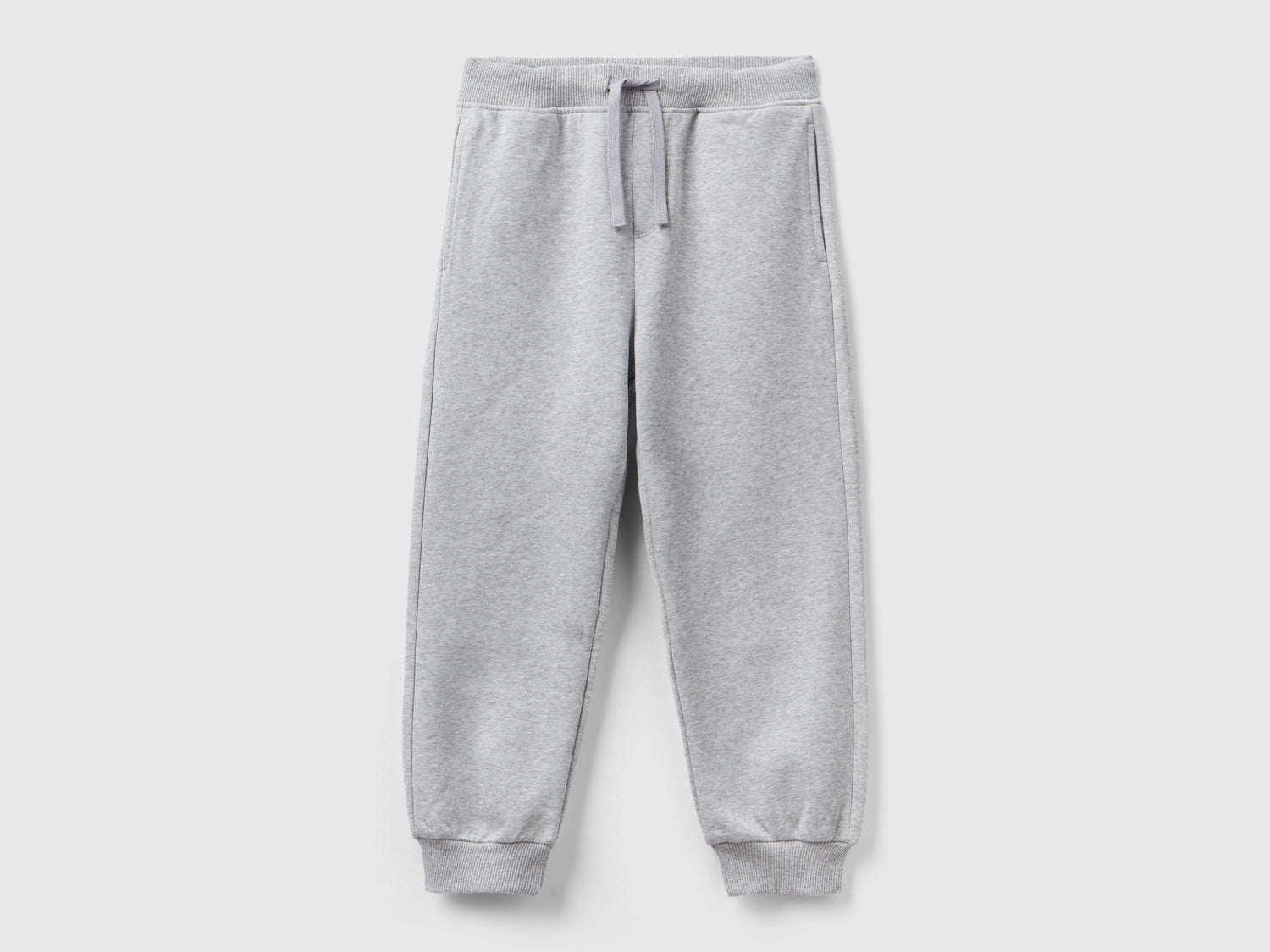 Pantaloni in calda felpa con stampa da bambino grigio chiaro | Benetton Outlet