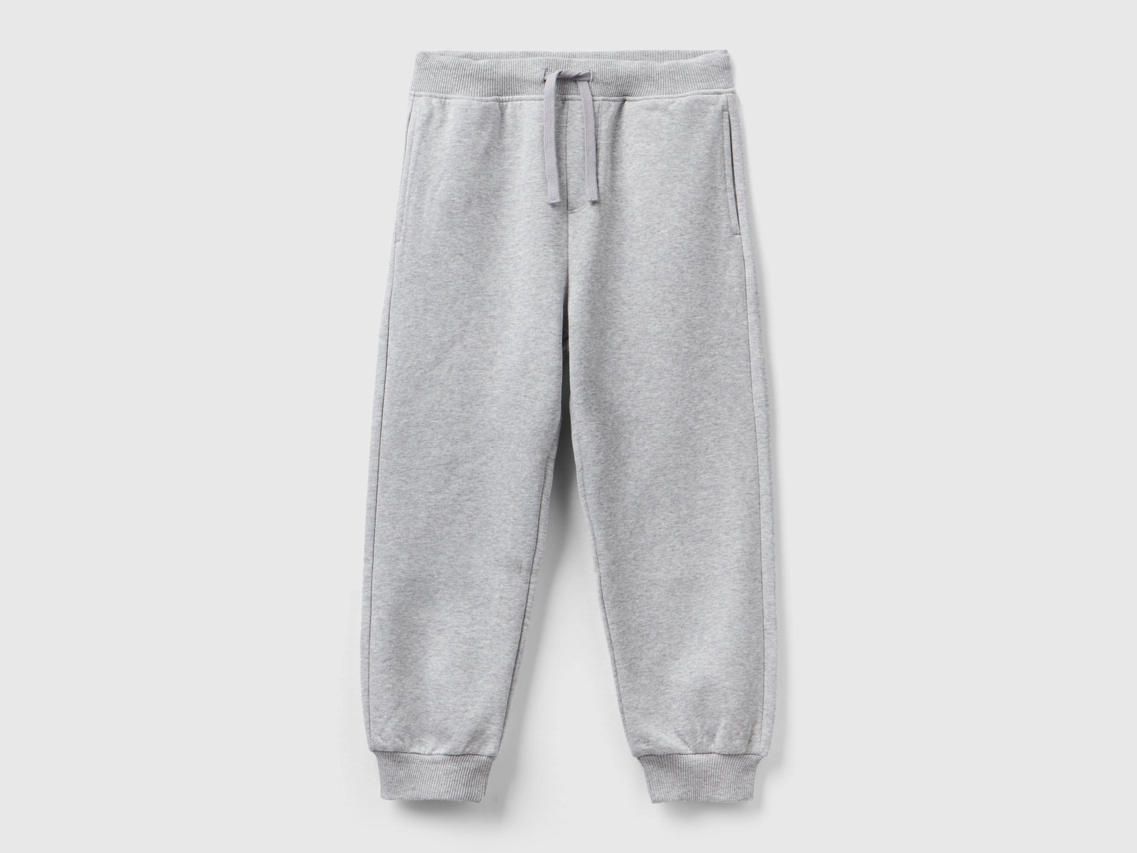 Pantaloni in calda felpa con stampa da bambino grigio chiaro | Benetton Outlet