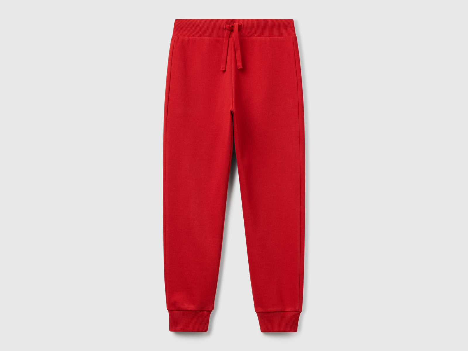 Pantaloni sportivi con coulisse da bambino rosso | Benetton Outlet