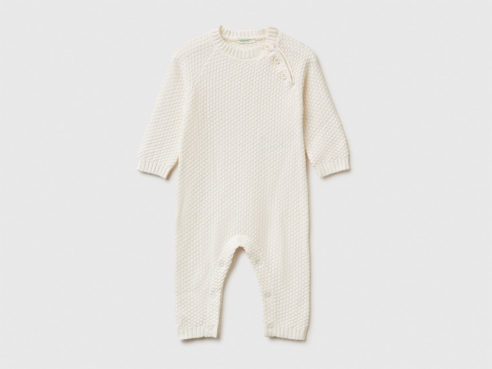 Tuta girocollo in maglia da neonato bianco panna | Benetton Outlet