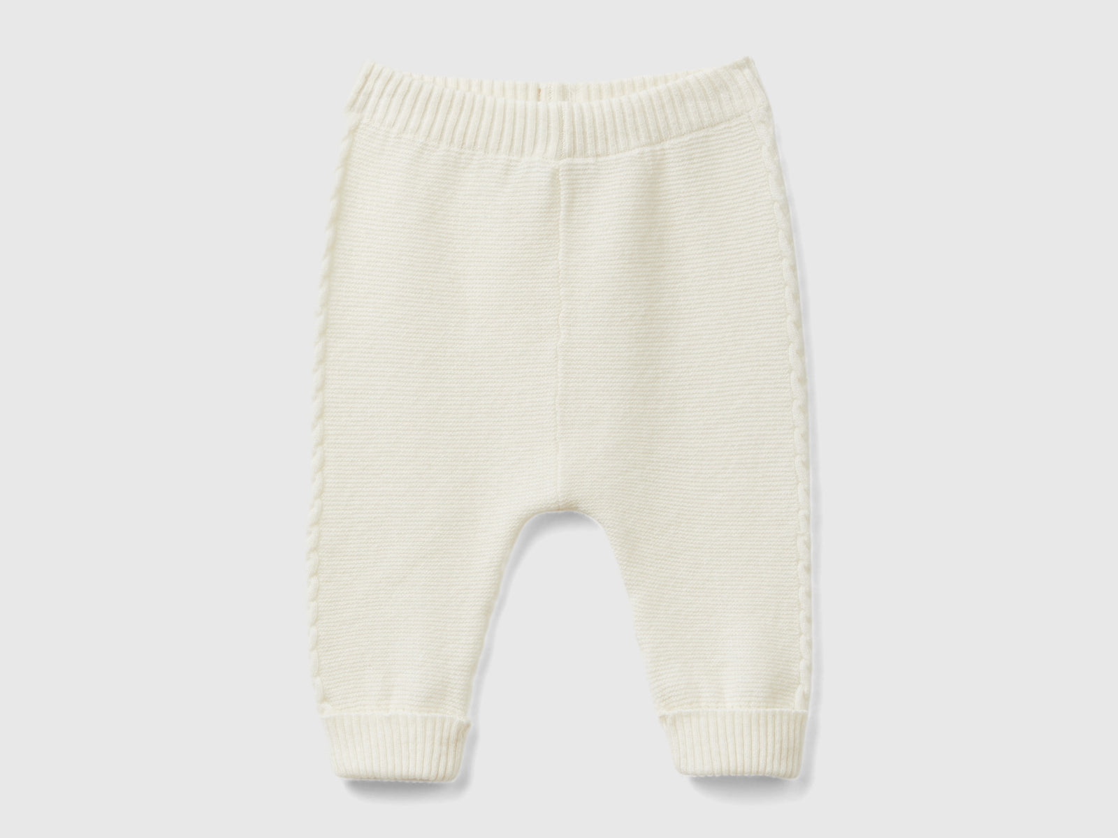 Pantaloni con trecce in misto lana riciclata da neonato bianco panna | Benetton Outlet