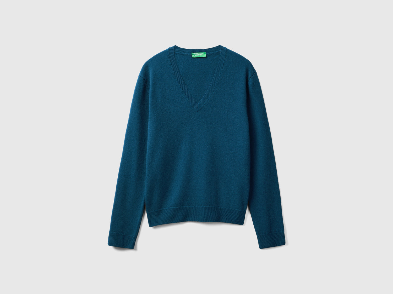 Maglia con scollo a V in pura lana Merino da donna blu | Benetton Outlet