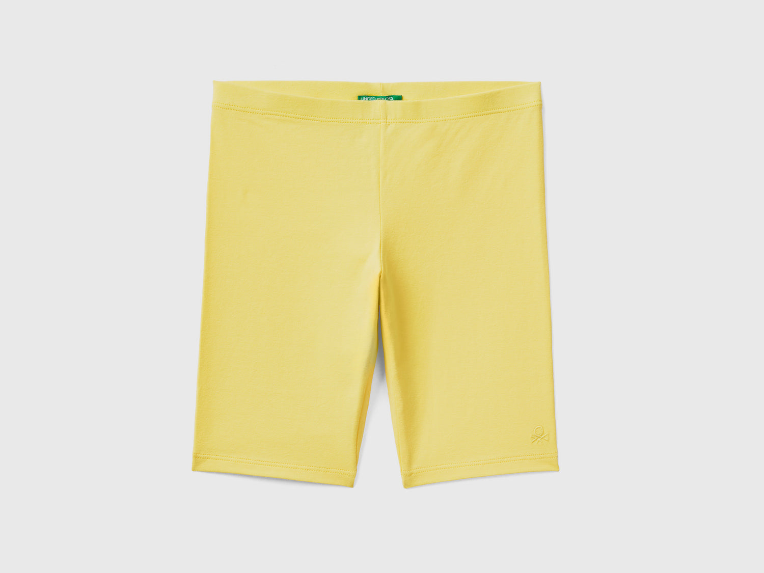Leggings corti modello ciclista in cotone elasticizzato da bambina giallo | Benetton Outlet