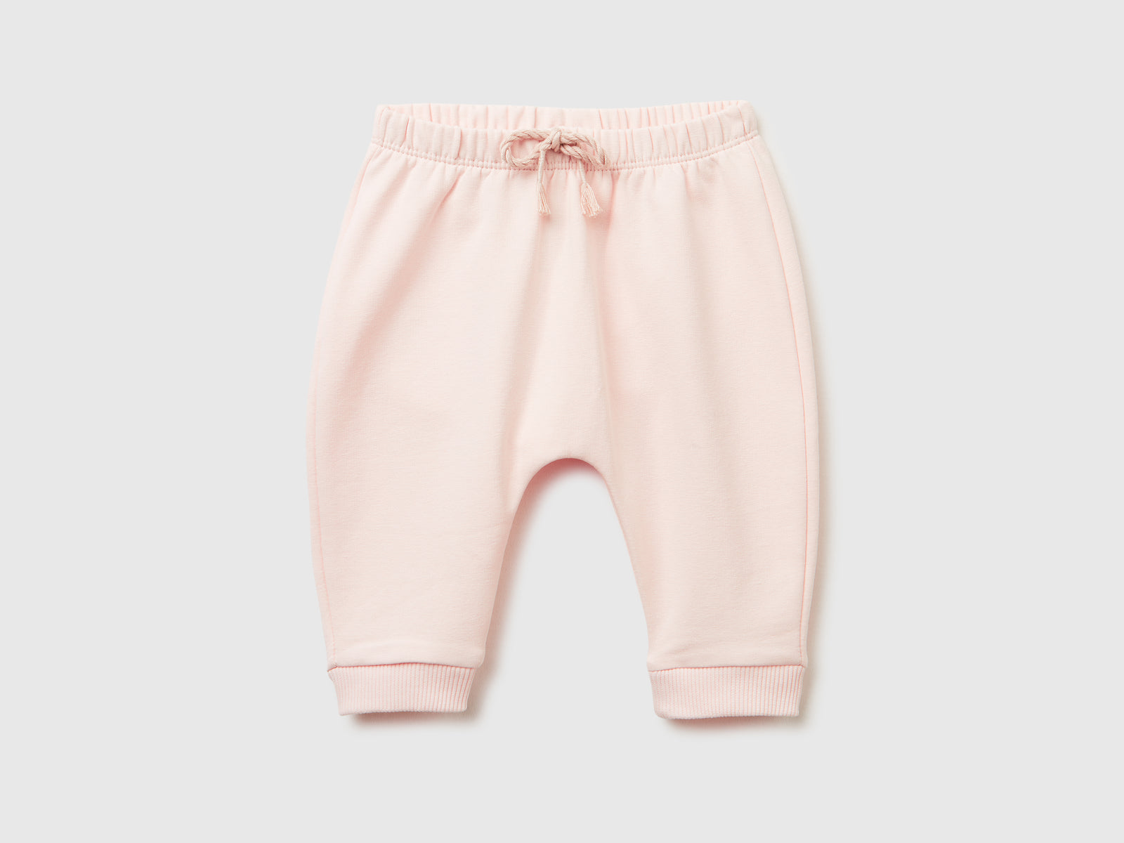 Pantaloni in calda felpa con taschino da neonato rosa tenue | Benetton Outlet