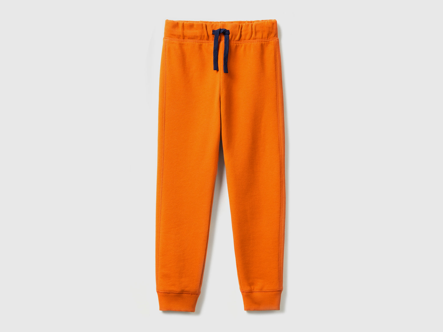 Pantaloni in felpa 100% cotone da bambino arancione | Benetton Outlet