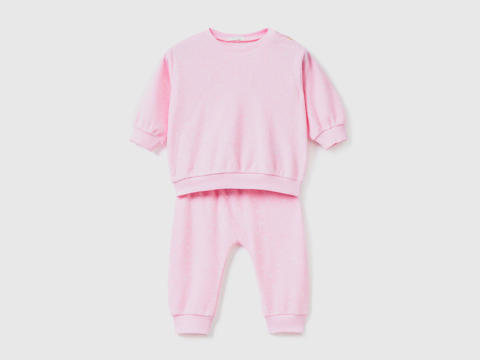 Set maglia e pantaloni in spugna di misto cotone con stampa fantasia da neonato rosa | Benetton Outlet