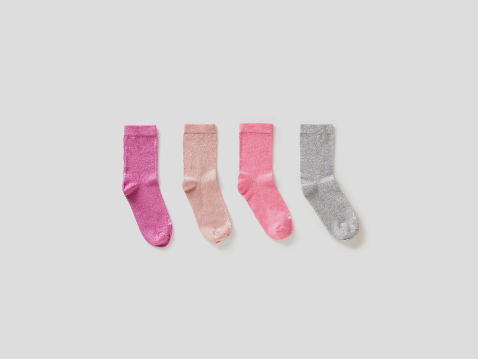 Quattro paia di calze in cotone  stretch da bambino rosa | Benetton Outlet