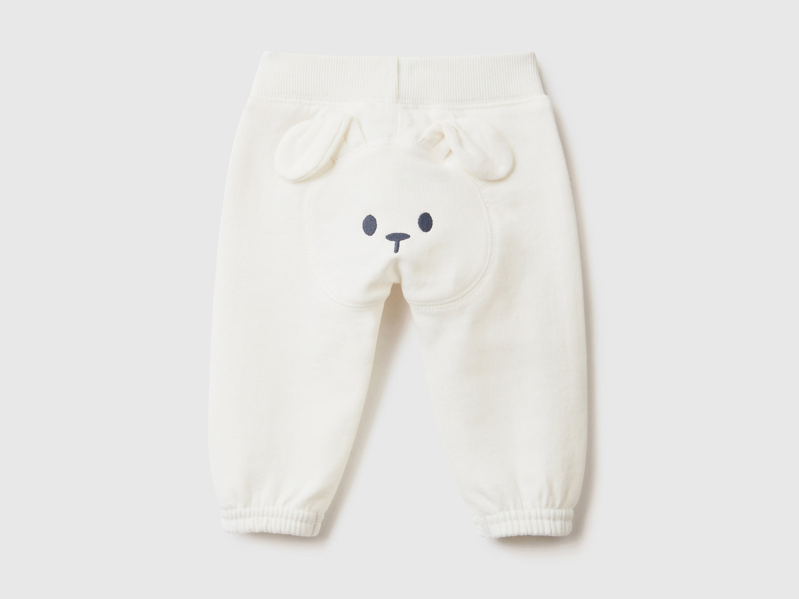 Pantaloni lunghi in felpa di puro cotone da neonato bianco panna 2 | Benetton Outlet
