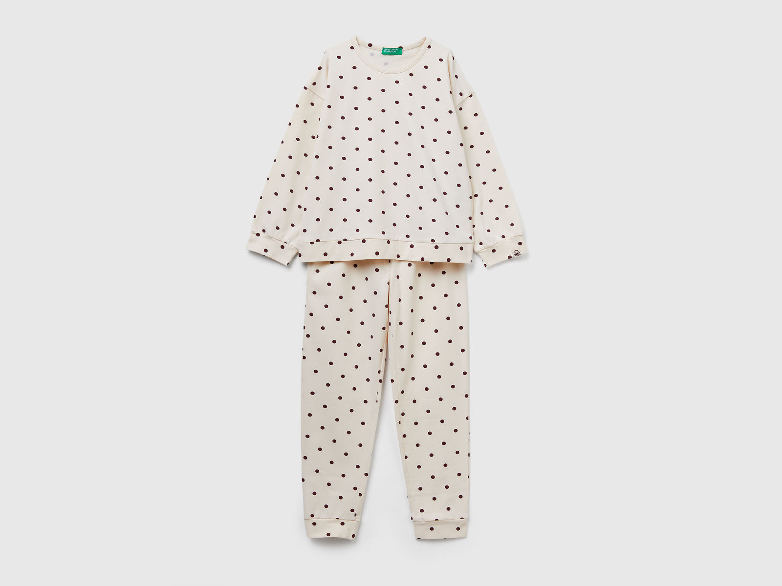 Caldo pigiama a pois da bambina bianco panna | Benetton Outlet