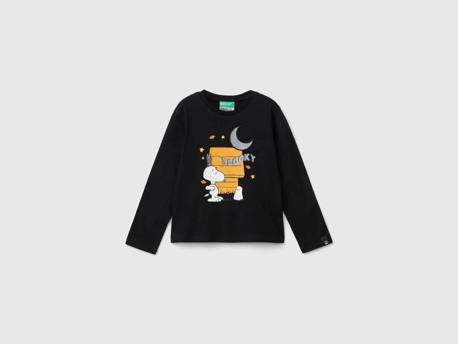 Maglietta ©Peanuts con stampa glitterata da bimba nero | Benetton Outlet
