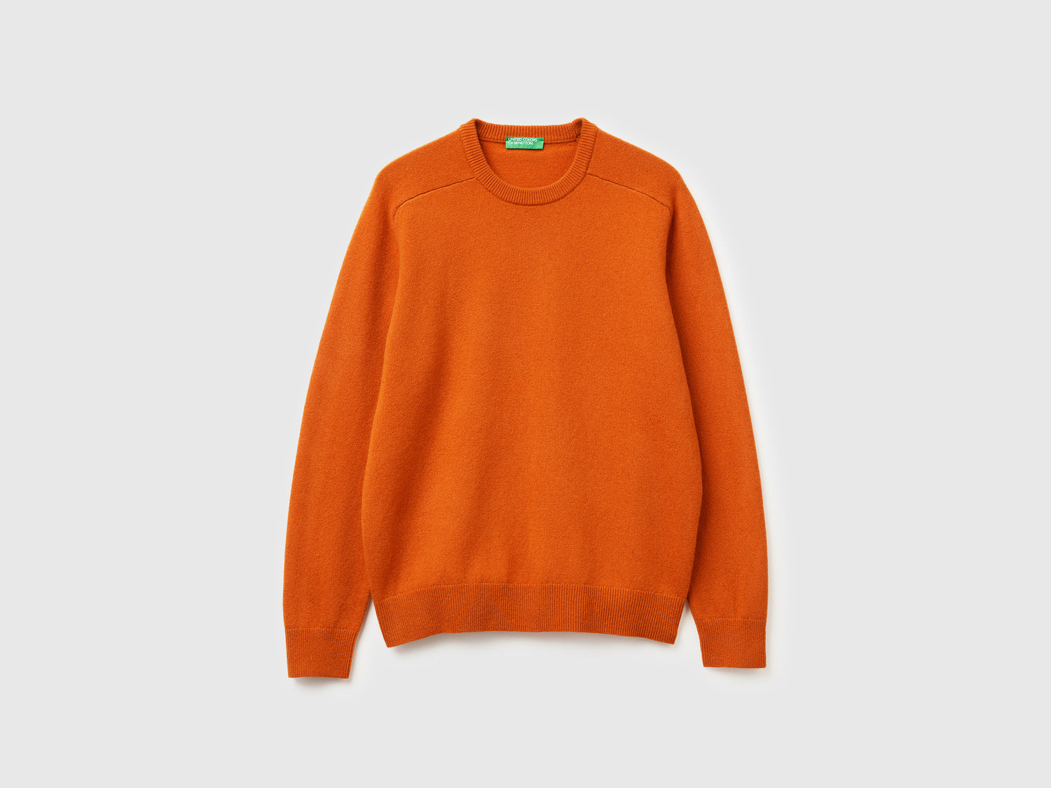 Maglia girocollo in pura lana Merino da uomo arancione | Benetton Outlet