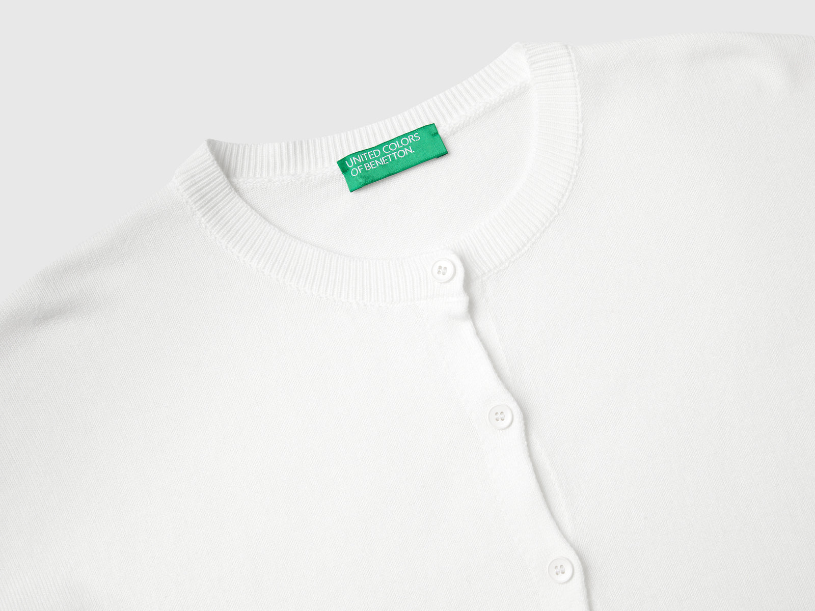Cardigan girocollo con bottoni da donna bianco panna 3 | Benetton Outlet