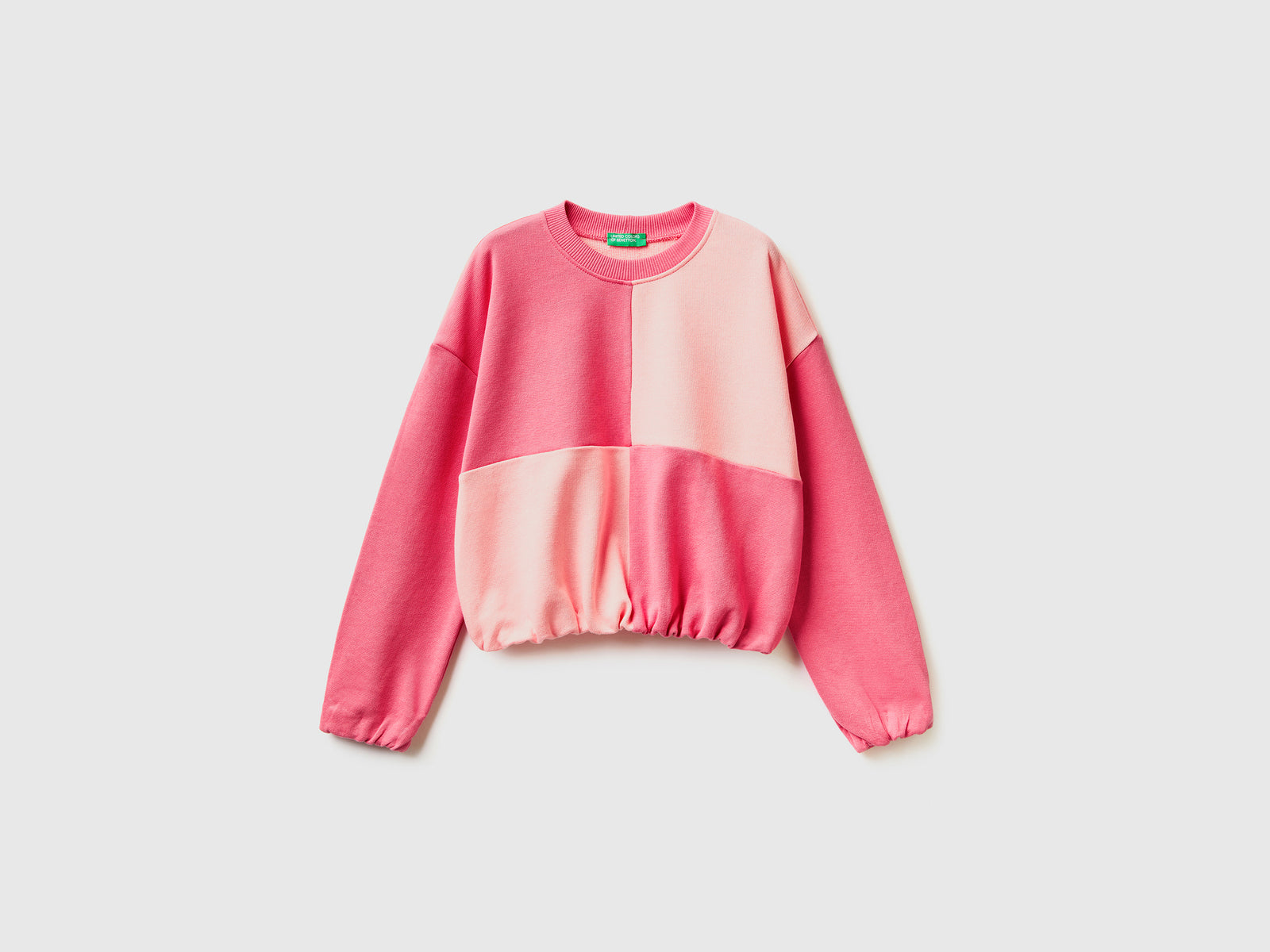 Felpa con maxi quadri da bambina rosa | Benetton Outlet