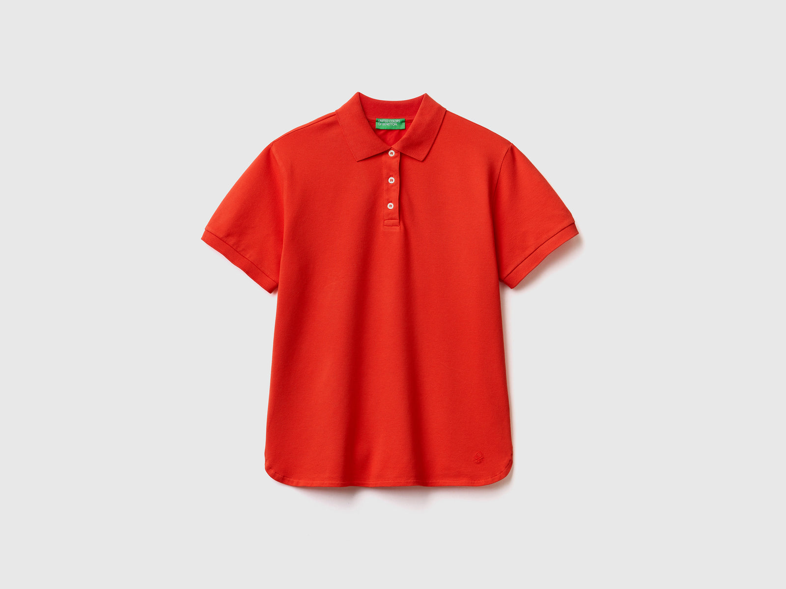 Polo a manica corta in piquet di cotone elasticizzato da donna rosso | Benetton Outlet