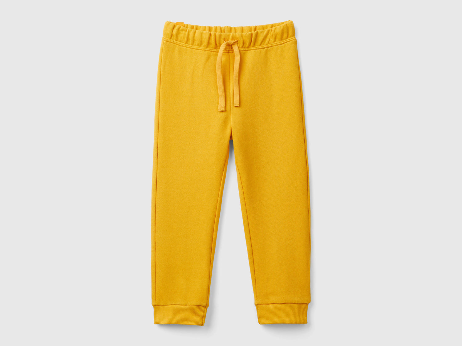 Joggers in felpa regular fit da bimbo senape | Benetton Outlet